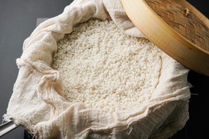 sticky rice in steamer lined with cheesecloth