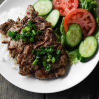 vietnamese pork chop with rice and veggies