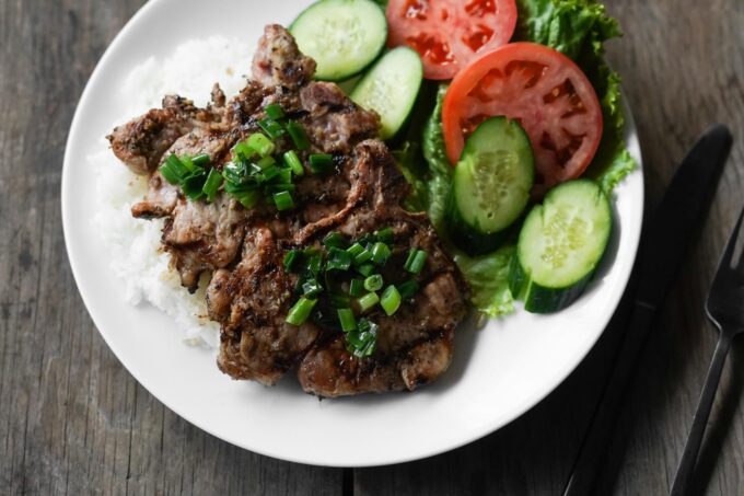 vietnamese pork chop with rice and veggies