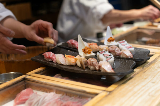 two pre-set meals being prepared at Sushi Itadori Bekkan