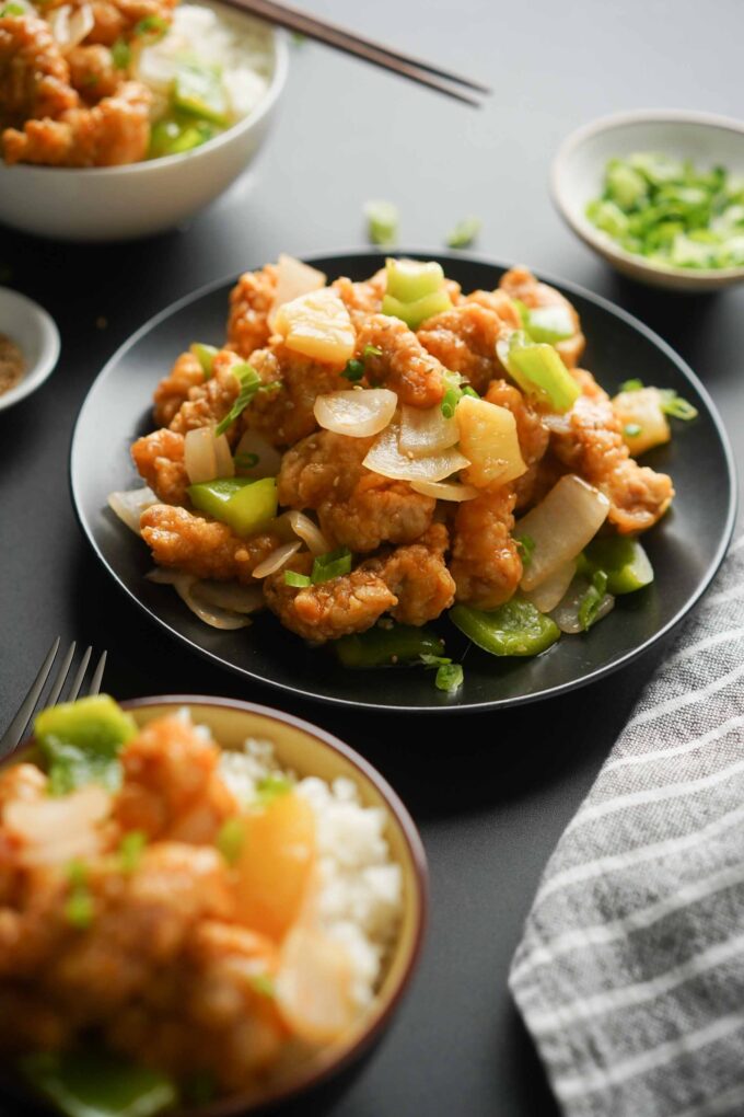 bowl of sweet and sour pork w onion, bell pepper