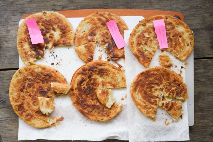 six scallion pancakes made with different dough recipes
