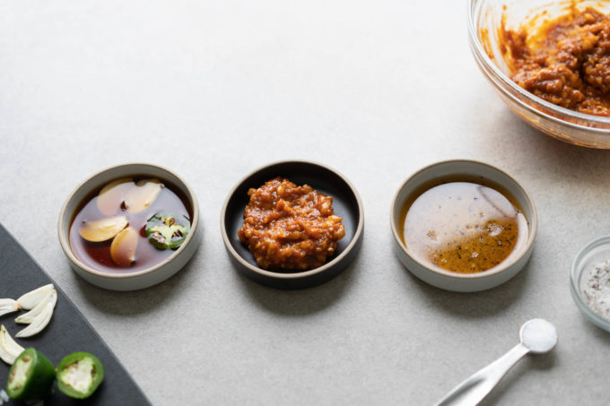 three small plates of Korean BBQ dipping sauces