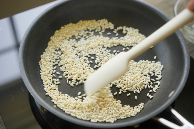 toasting rice in a pan