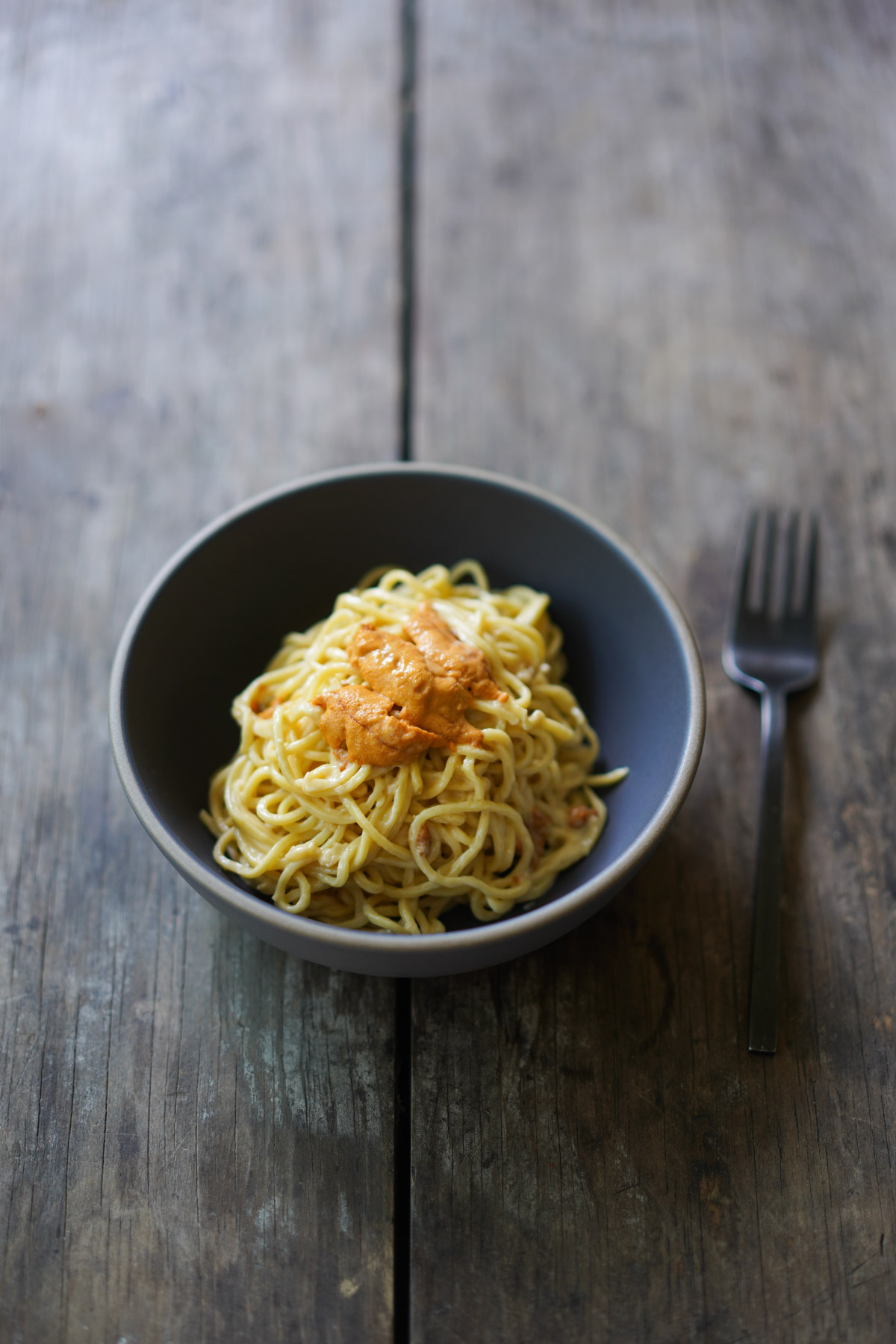 uni pasta in a bowl, and fork