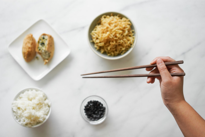 using chopsticks with various foods