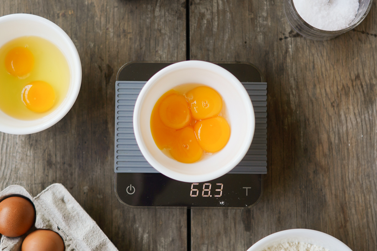 weighing eggs and flour for pasta