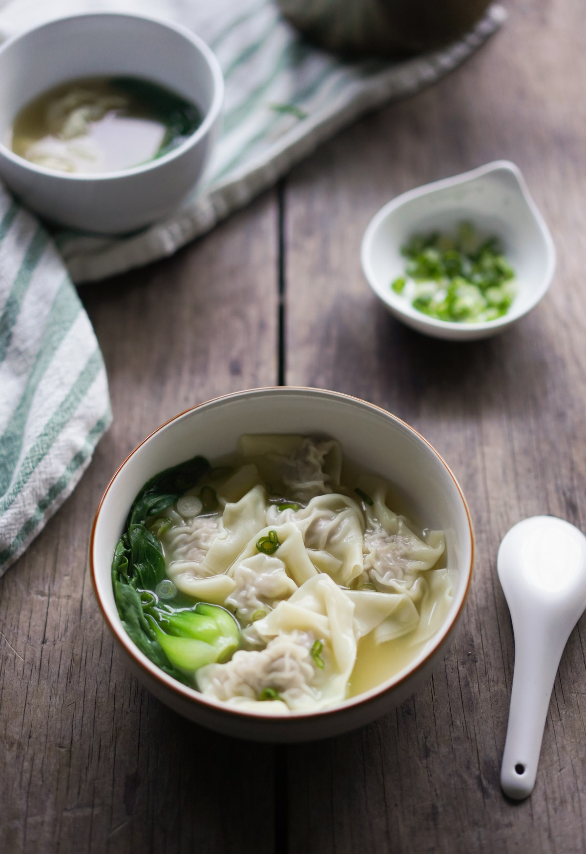 a comforting bowl of wonton soup and bok choy