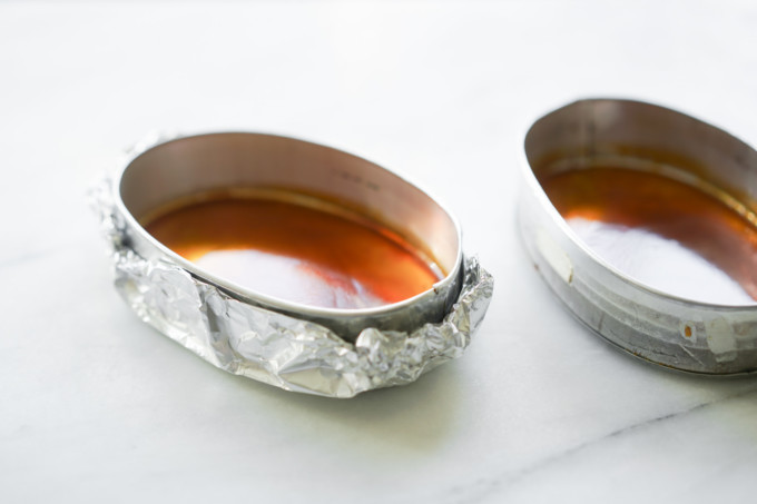 flan molds wrapped in aluminum foil